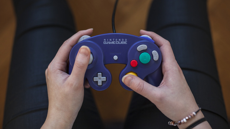 Person using a Nintendo Gamecube controller