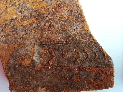 Christina Marabea Archaeologists discovered tile fragments inscribed with the name of the Greek hero (Credit: Christina Marabea)