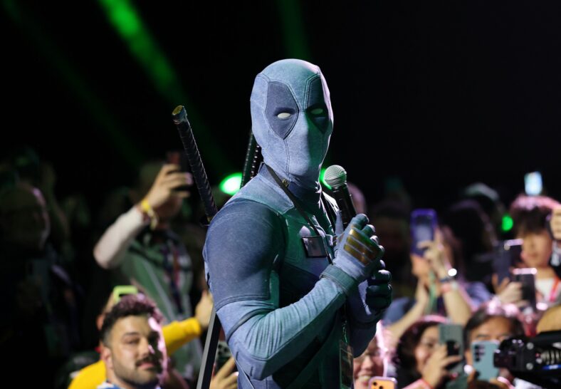 Ryan Reynolds wears a denim Deadpool costume at Comic-Con