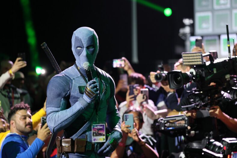 Ryan Reynolds wears a denim Deadpool costume at Comic-Con