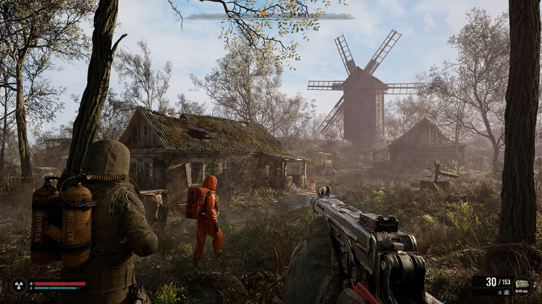 A group of soldiers approach an abandoned farm in "S.T.A.L.K.E.R. 2: Heart of Chornobyl" (2024)