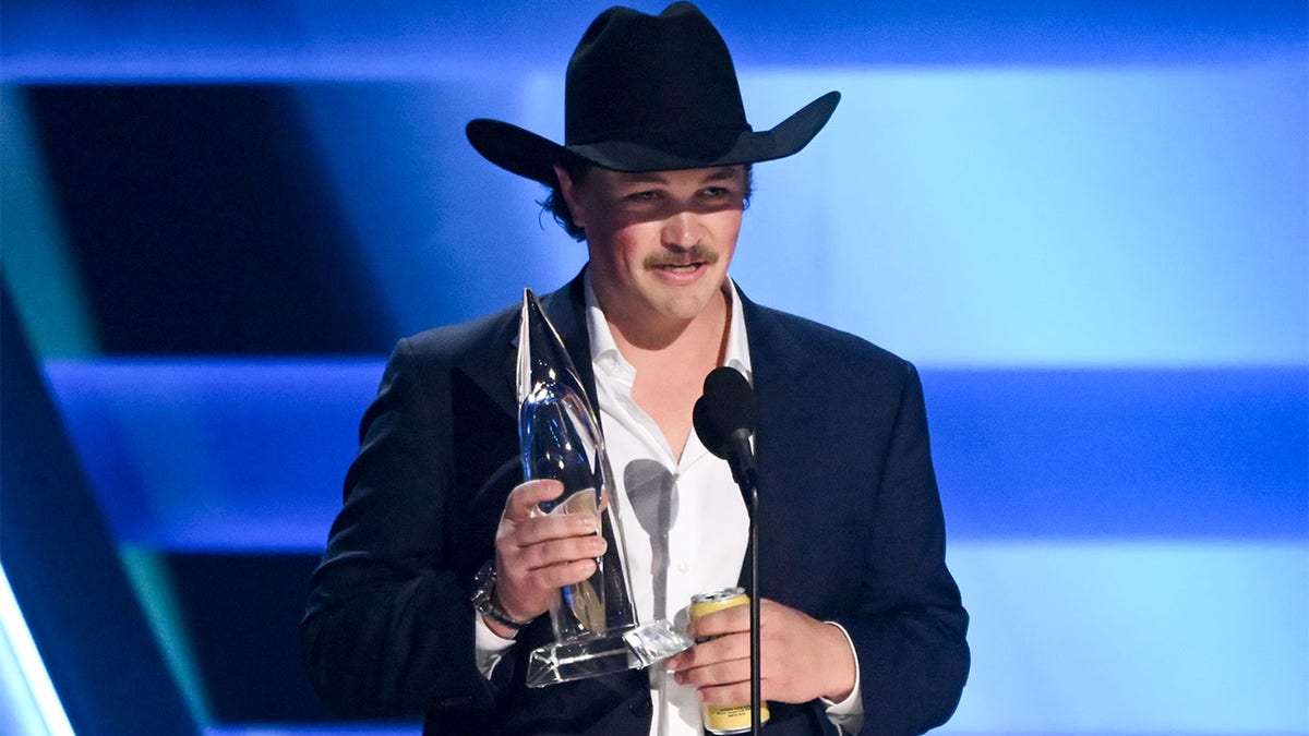 Zach Top accepting his 2025 CMA Award for best new artist.