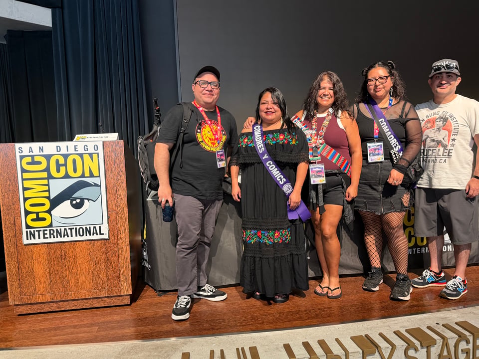 Henry Barajas, Comadres y Comics Podcast co-shosts (Sara Bazan, Kristen Parraz, Jennifer Lopez), and Omar Moralas on stage at the SD Library.