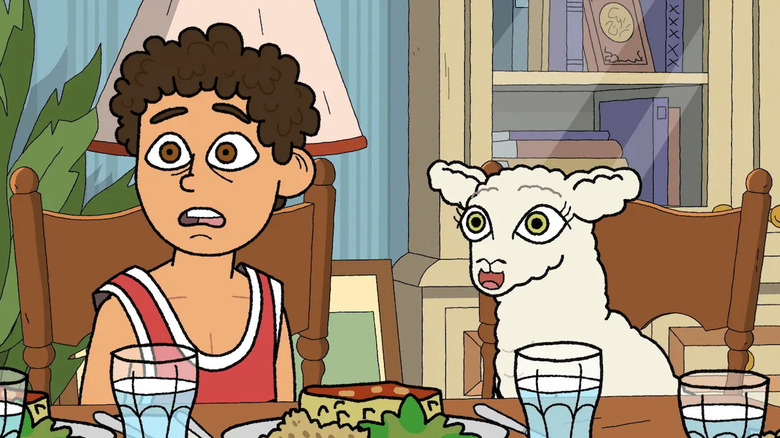 Rumi sits at the table with a sheep