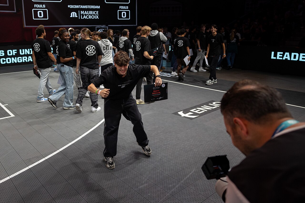 A player on the court at the FIBA 3x3 World Tour Amsterdam Masters, with the event scoreboard behind him