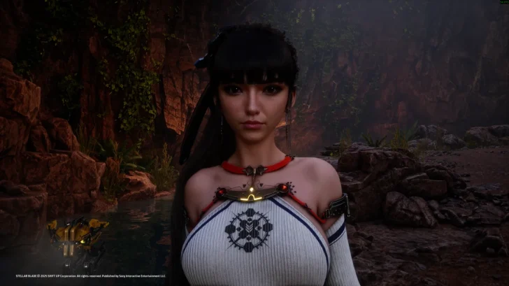 A character from the game 'Stellar Blade' standing in a rocky, lush environment.
