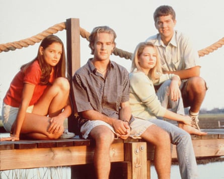Teenagers sitting on a pier
