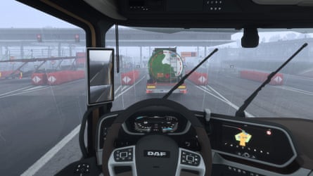 A snapshot from the drivers seat inside of a truck.