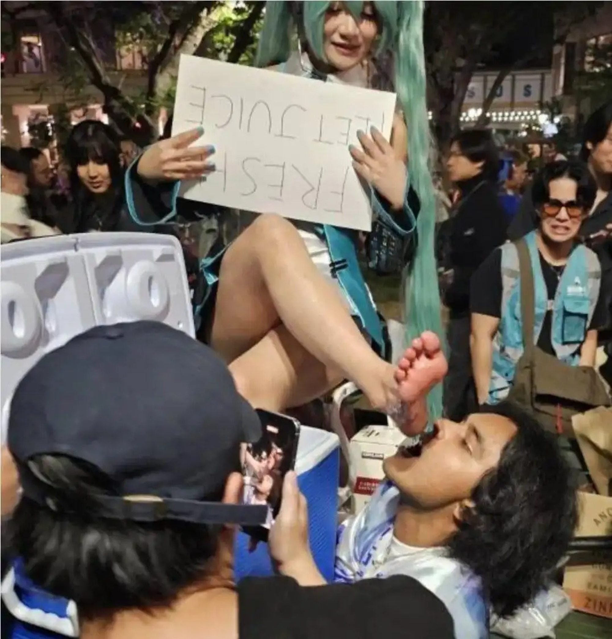One convention attendee was captured kneeling with their mouth agape, attempting to catch drops of “feet juice” as they flowed from a cosplayer — an image that quickly went viral. Photo: Handout