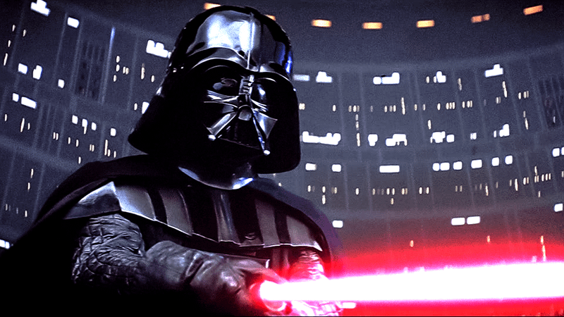 Darth Vadar points a red lightsaber at his opponent.