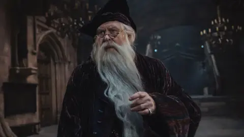 Lara Cornell/HBO John Lithgow in a robe, hat and long grey beard