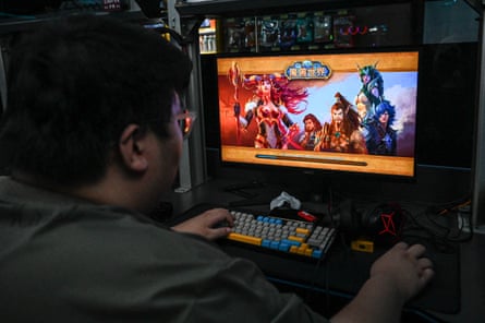 A Chinese gamer plays World of Warcraft at an internet cafe in Beijing in 2024.