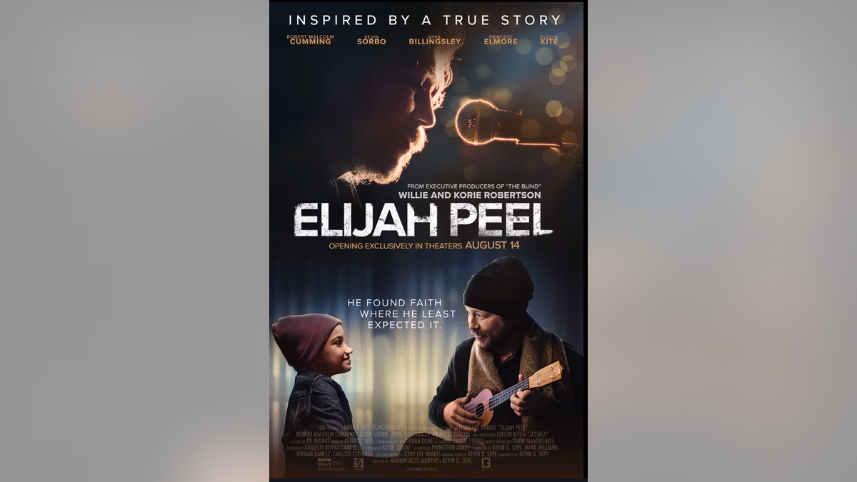holding a small guitar looks at a young girl beneath the Elijah Peel movie title.