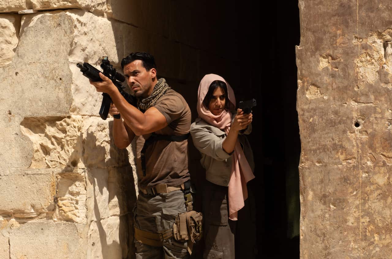 Tewfik Jallab as Vincent Taleb and Ritu Arya as Zara Taylor in 'Apollo Has Fallen'.
