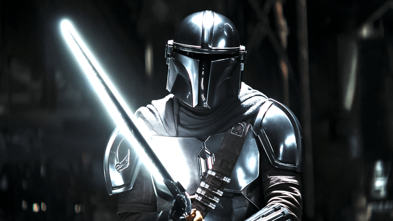 Din Djarin carrying the iconic Darksaber.