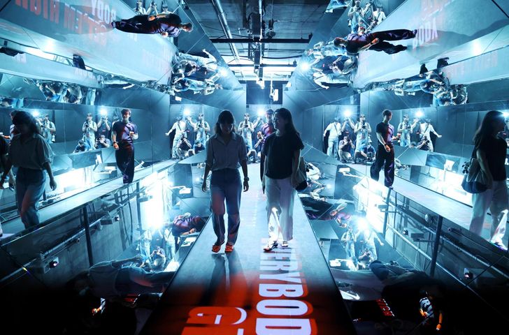 Visitors walk through “COSMOS,” a media exhibition marking the 20th anniversary of K-pop group BIGBANG, at the newly opened K-Culture Station in central Seoul, Monday. Yonhap