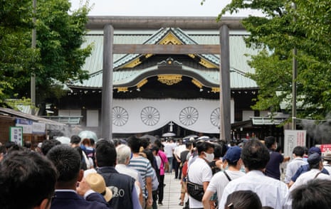 People queue to offer a prayer for war victims at the Yasukuni shrine in Tokyo, Japan.