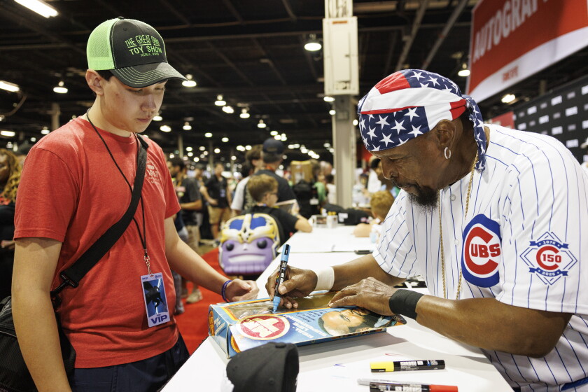 Mr. T signs autograph on fans photos and memorabilia during the Fan Expo Chicago at Donald E. Stephens Convention Center in Rosemont.