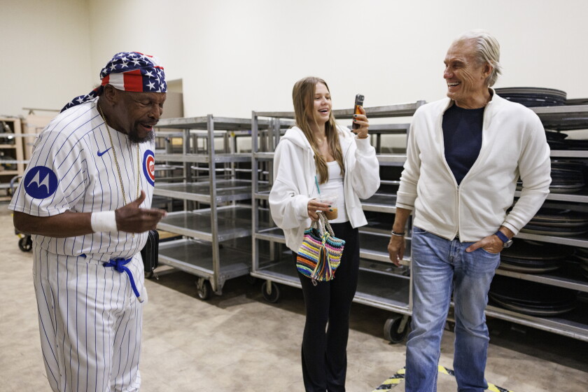 Mr. T, Dolph Lundgren, and Dolph Lundgren’s daughter share a laugh during the Fan Expo Chicago.