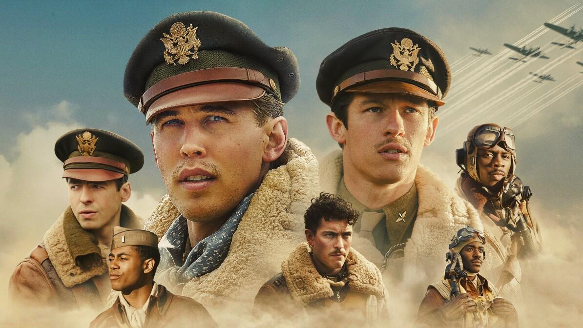 A group of men in World War II military uniforms against the backdrop of a cloudy sky.