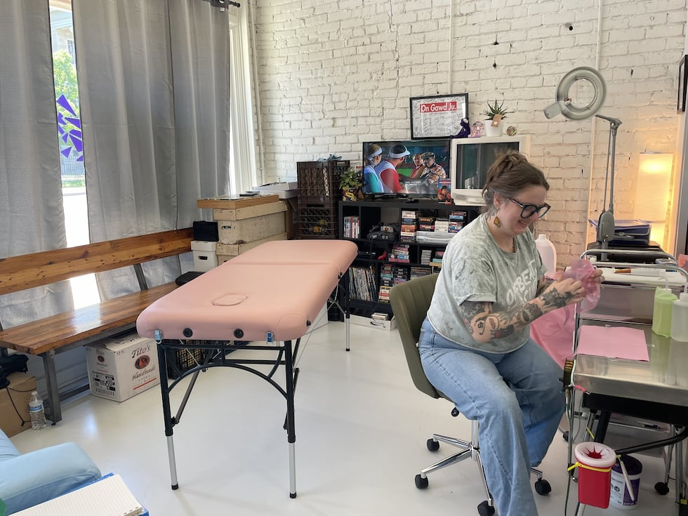Mallory Welch offered flash tattoos on Free Comic Book Day at OffBeat in Jackson, Mississippi.