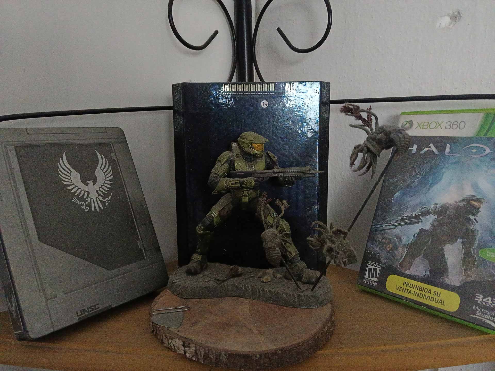 Copies of Halo with a Master Chief statue.