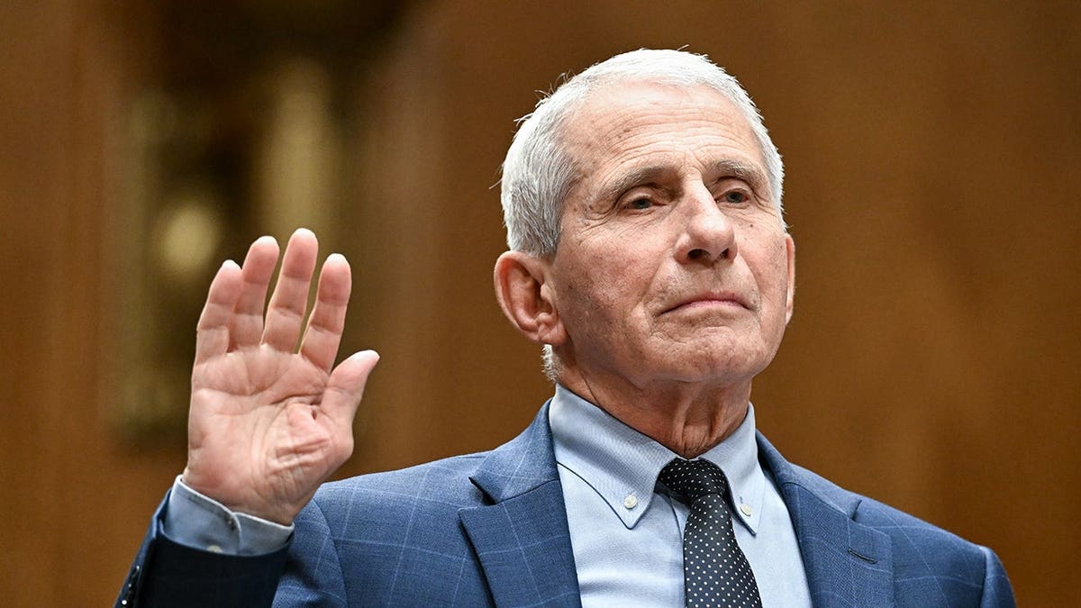 Dr. Fauci is shown being sworn in