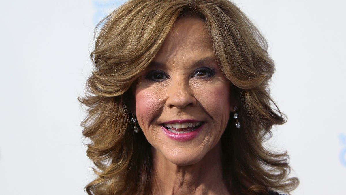 Linda Blair smiling at a red carpet event