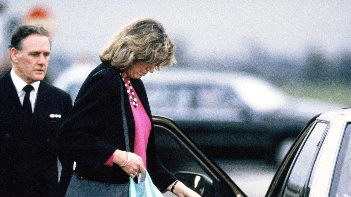 Sarah Lindsay waits at RAF Northolt for her husband Major Hugh Lindsay's coffin.