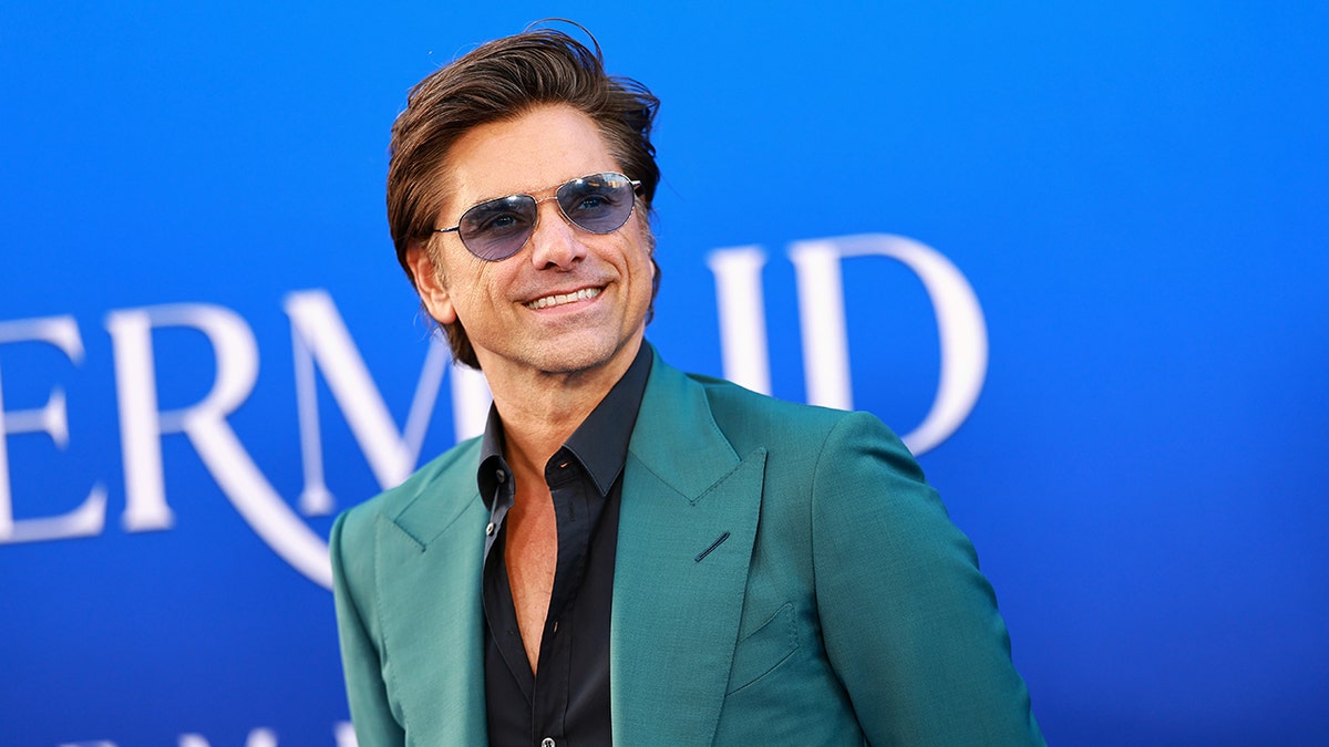 John Stamos at the premiere of the live action "Little Mermaid"