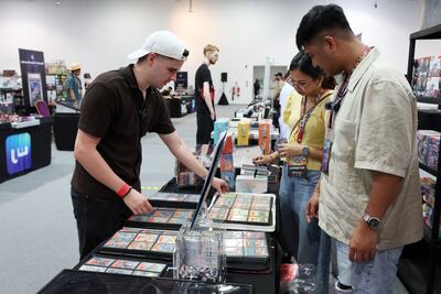 Trading cards were a major part of Playgrounds, with collectors browsing binders and discussing cards directly with vendors. Chris Whiteoak / The National