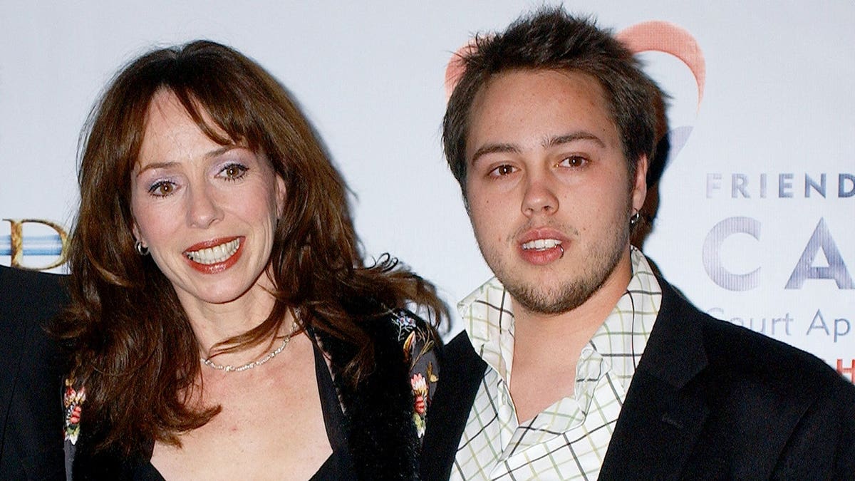 Mackenzie Phillips and Shane Barakan pose at the Pantages Theatre in Hollywood.