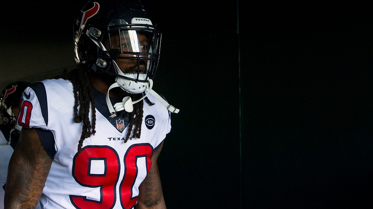 Jadeveon Clowney #90 of the Houston Texans walks on the field