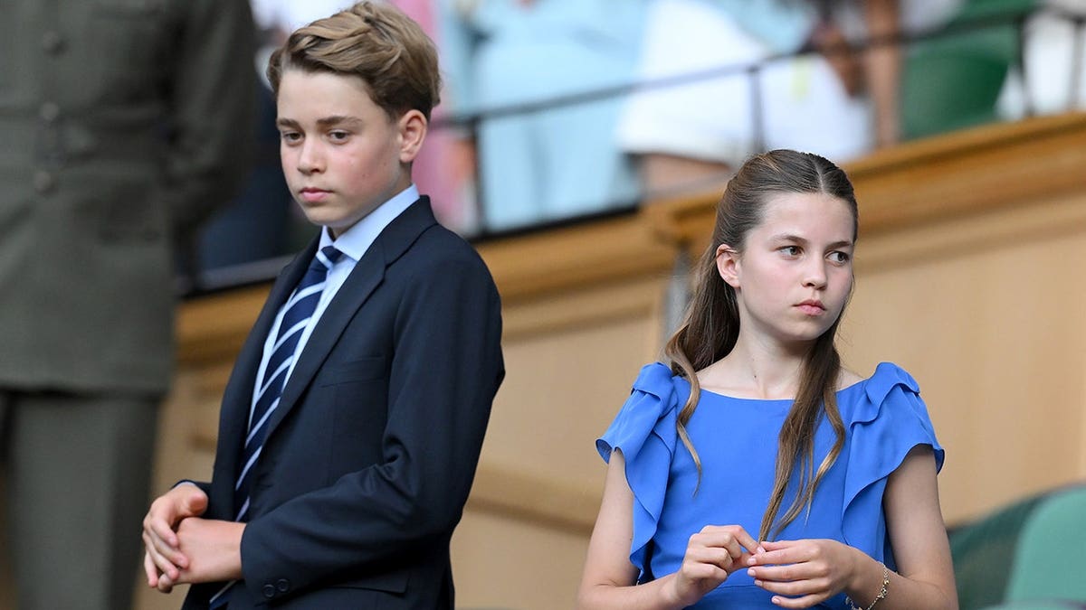 Prince George and Princess Charlotte stand together at Wimbledon.