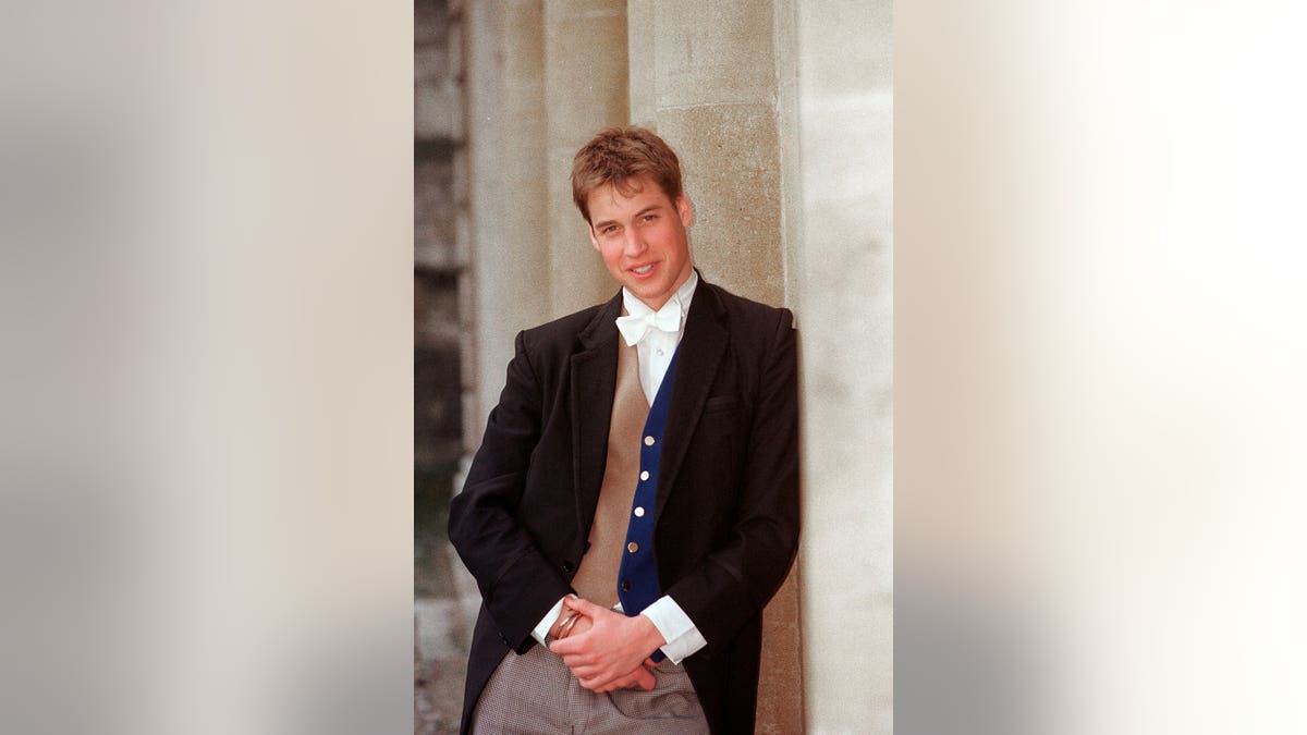 Prince William stands at Eton College wearing a waistcoat.