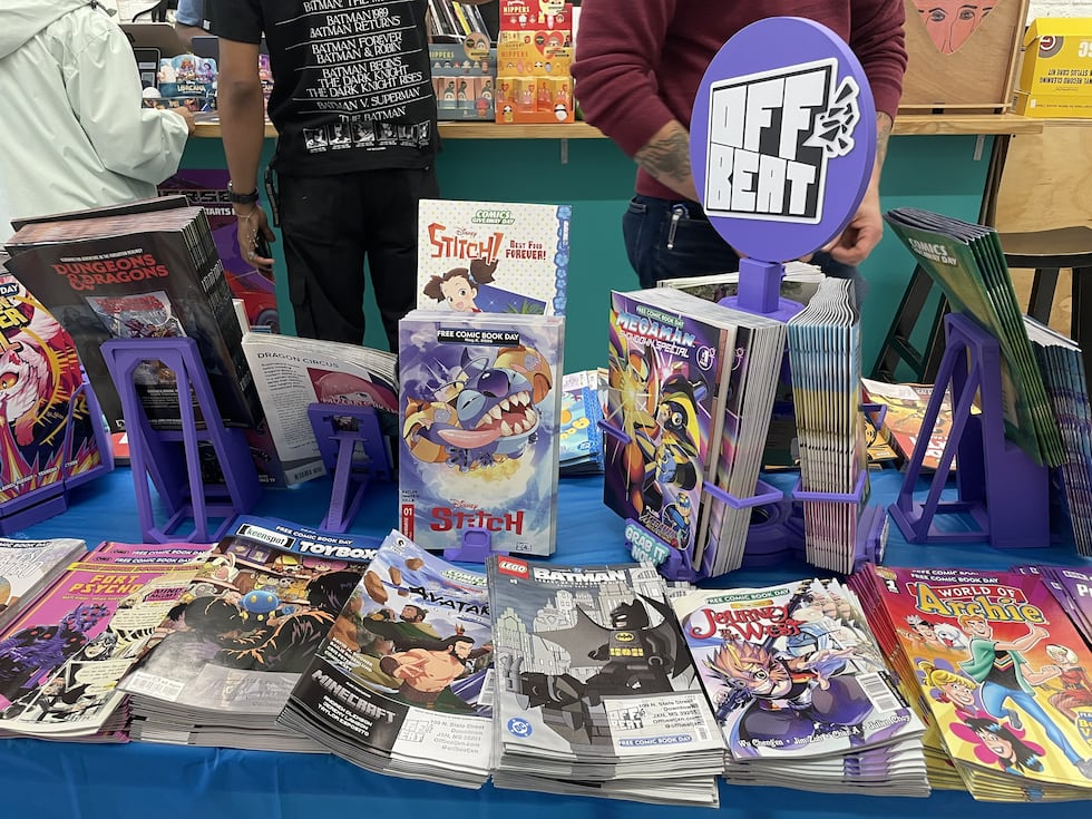 A table of comics on Free Comic Book Day at OffBeat.