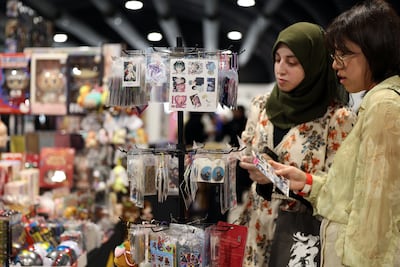 Visitors browse character merchandise and accessories at Playgrounds, where independent sellers and collectors gather around shared pop culture interests. Chris Whiteoak / The National