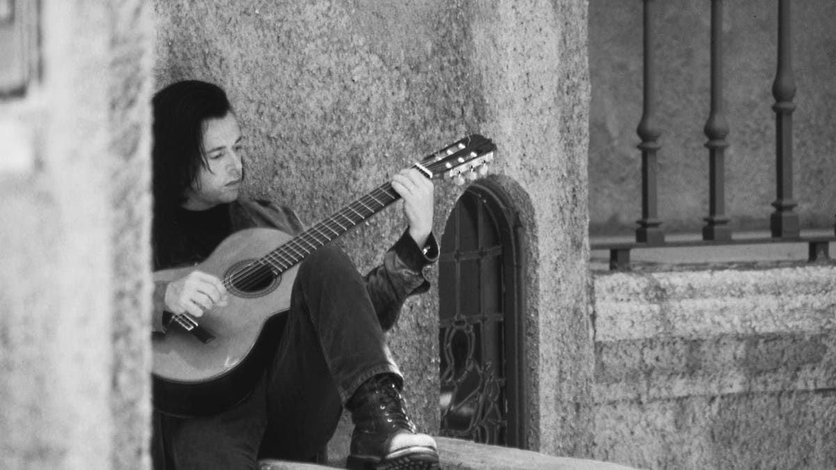 Roland Orzabal playing his guitar.
