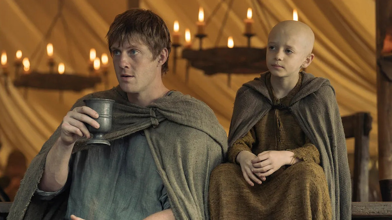 Duncan and Aegon sitting together at a feast in "A Knight of the Seven Kingdoms"