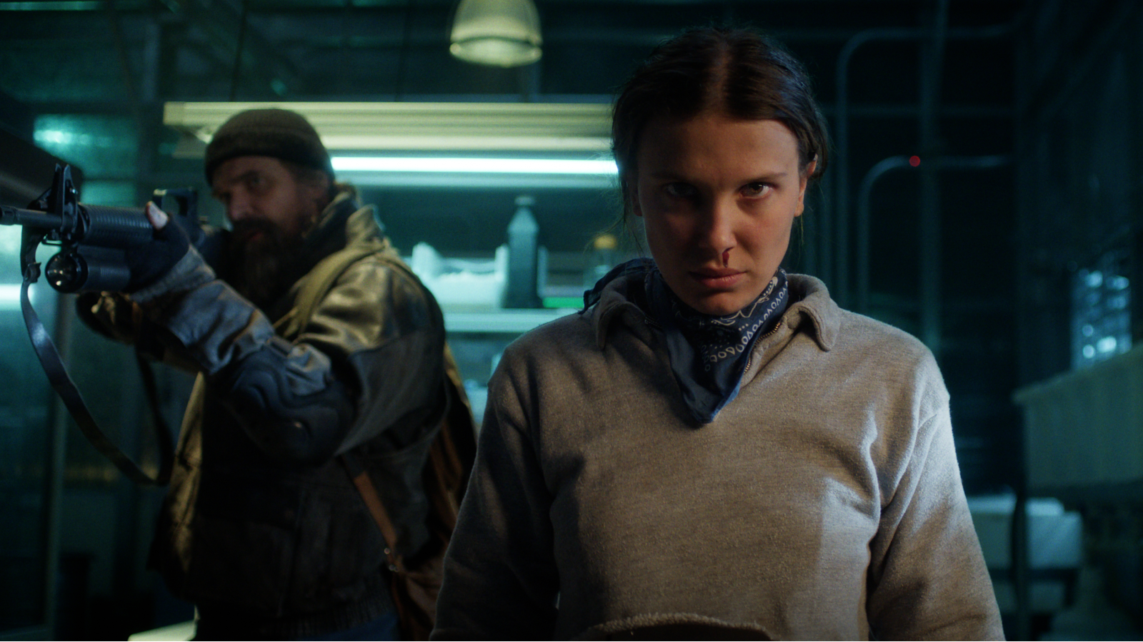 Millie Bobby Brown and David Harbour featured in a still from Stranger Things.