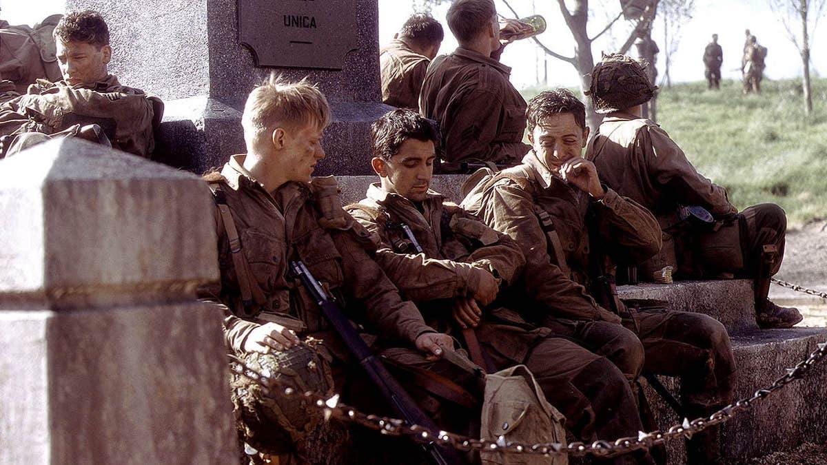 Dexter Fletcher, Marc Warren, James Maddio and Ben Caplan act in a scene from Band of Brothers.
