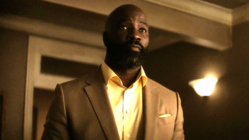 Mike Colter as Luke Cage in yellow shirt and light suit in 'Daredevil: Born Again' Season 2.
