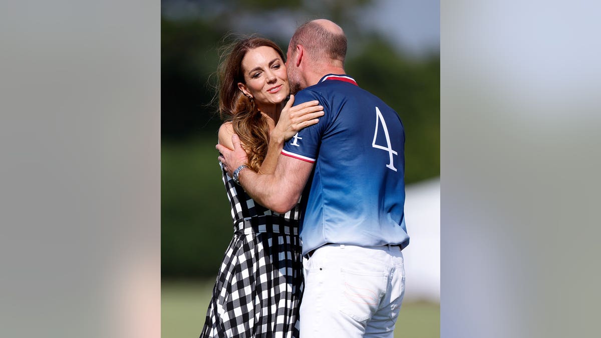 Catherine, Princess of Wales kisses Prince William at a polo event in Windsor, England.