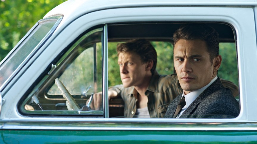 A still from 11.22.63 with the two main characters sitting in a car.