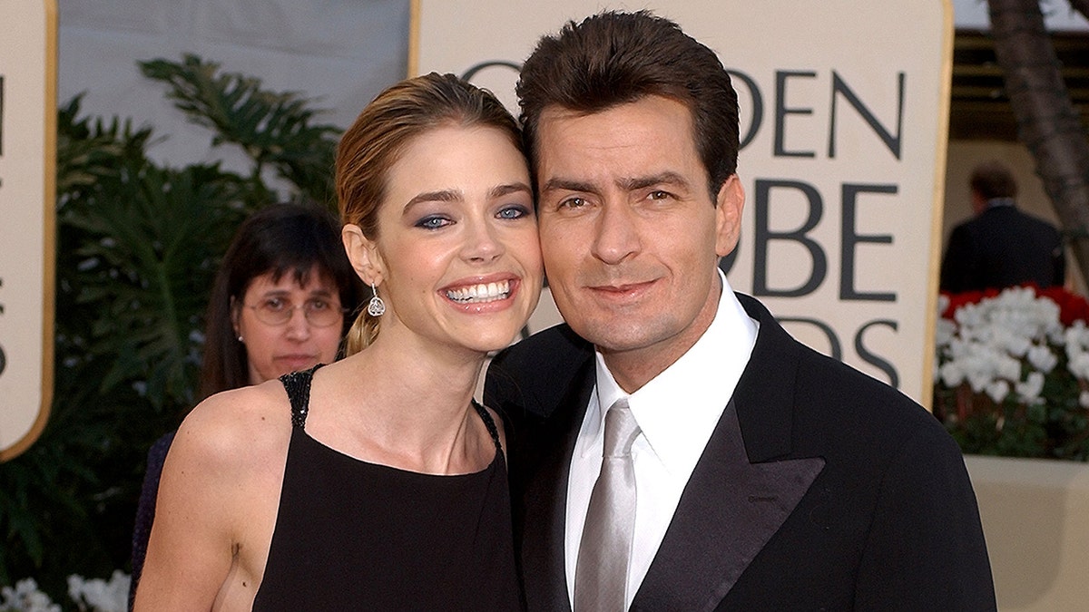 Denise Richards smiling with Charlie Sheen
