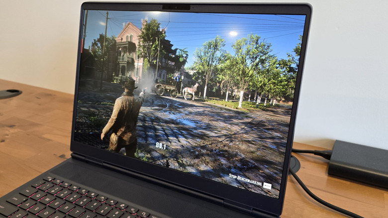 Alienware 16X Aurora screen showing "Red Dead Redemption 2" benchmark running