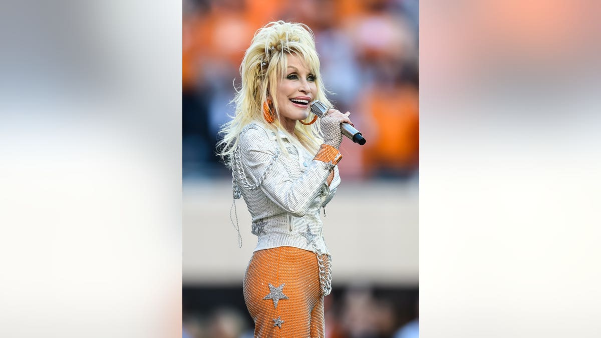 Dolly Parton performs at Neyland Stadium during a college football game.