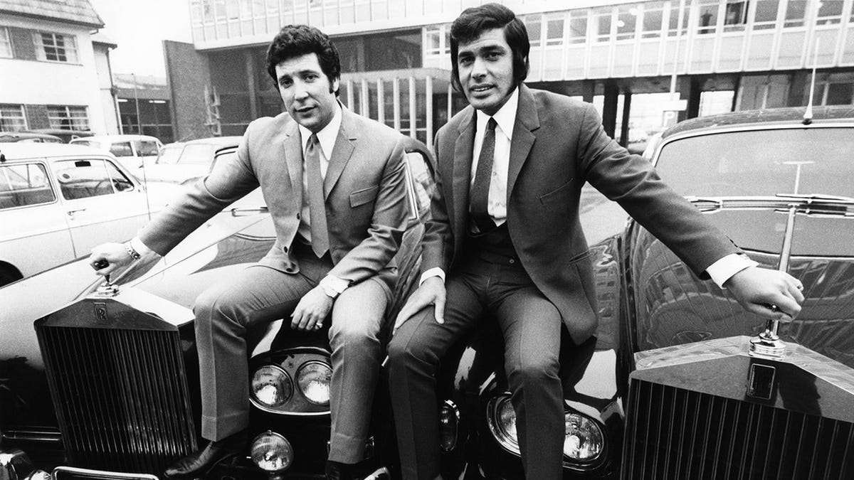 Tom Jones and Engelbert Humperdinck sit on a Rolls-Royce.