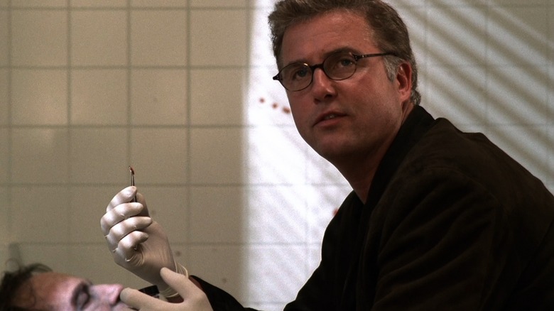 Dr. Gil Grissom investigates a crime scene in "CSI: Crime Scene Investigation" (2000)