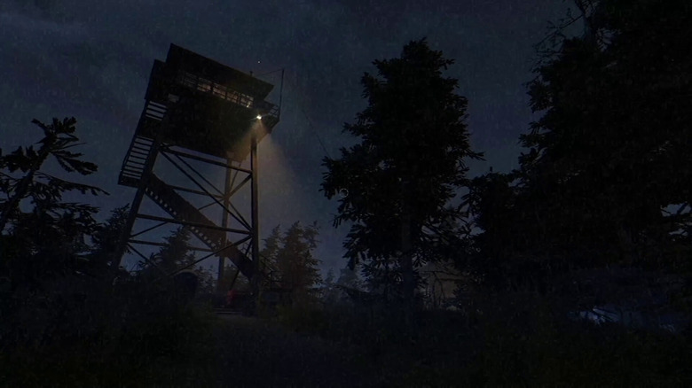 A lookout station shines a light down into a forest at night in Fears to Fathom: Ironbark Lookout
